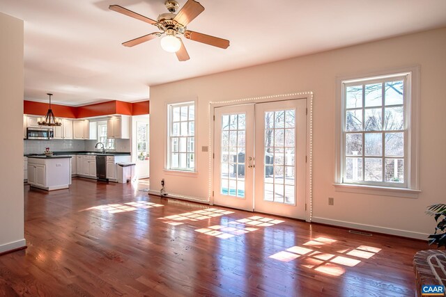 foyer entrance featuring hardwood / wood-style flooring and a high ceiling