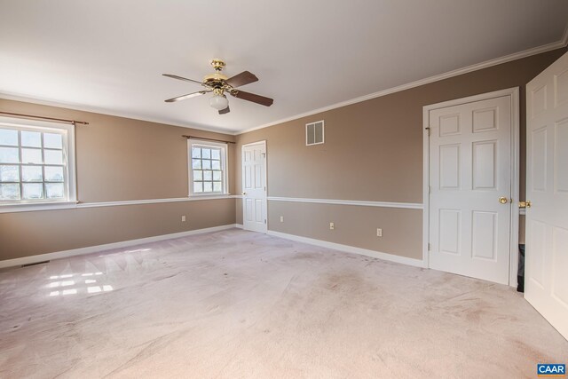 living area with crown molding and light wood-type flooring