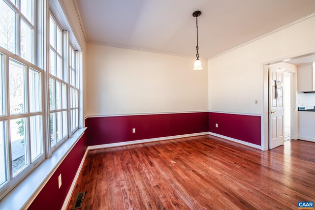 kitchen featuring dark wood-type flooring, pendant lighting, white cabinets, and stainless steel fridge with ice dispenser