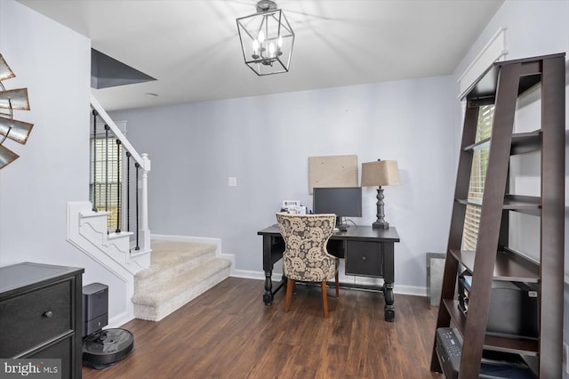 office featuring baseboards, wood finished floors, and a notable chandelier