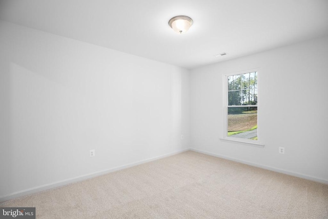 unfurnished room featuring carpet flooring