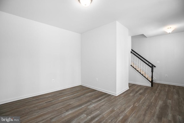 spare room with dark hardwood / wood-style flooring