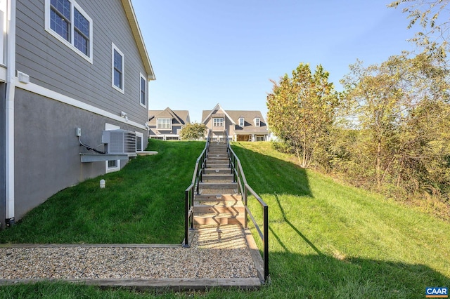 view of yard featuring central AC unit