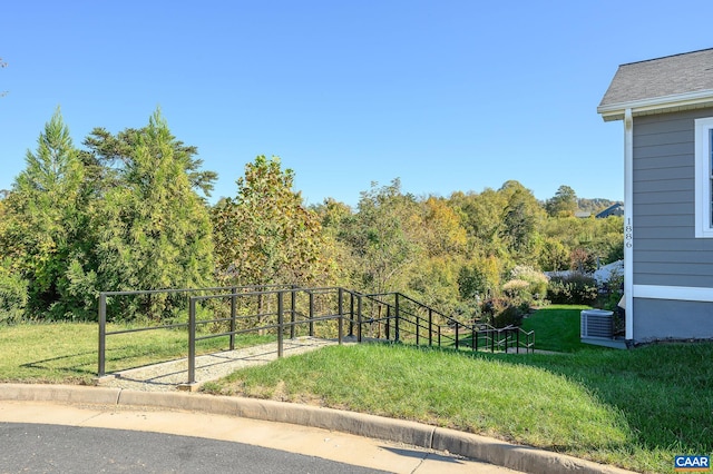 view of yard with central AC