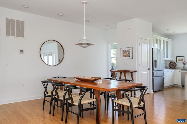 dining room with light hardwood / wood-style flooring