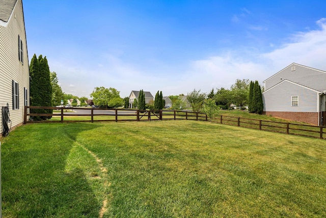 view of yard with a fenced backyard