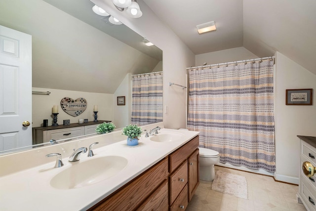 full bath featuring double vanity, a sink, lofted ceiling, and toilet