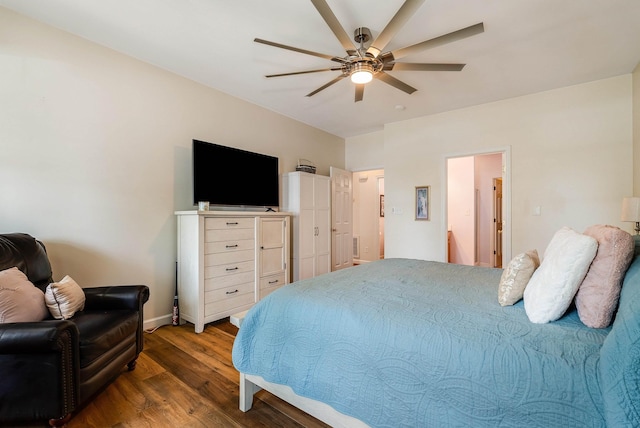 bedroom with baseboards, ceiling fan, and wood finished floors