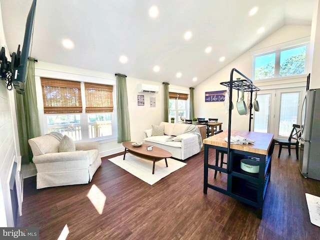 living room with vaulted ceiling, a healthy amount of sunlight, a wall mounted air conditioner, and dark hardwood / wood-style floors