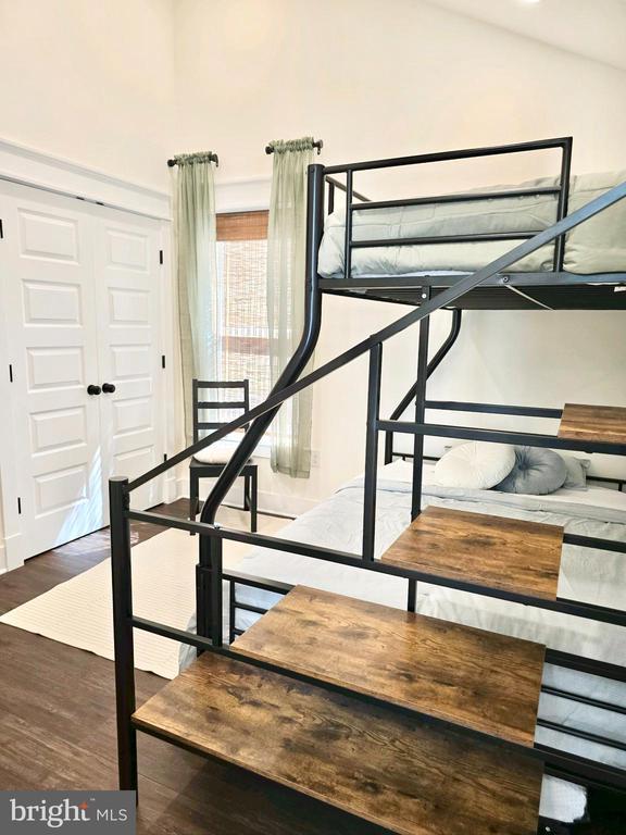 interior space featuring vaulted ceiling and hardwood / wood-style floors