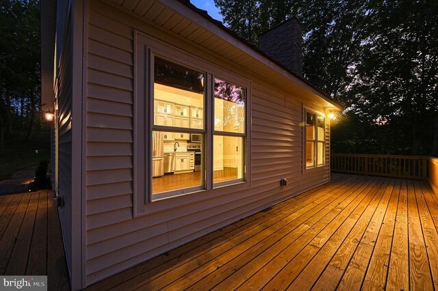 wooden terrace featuring sink