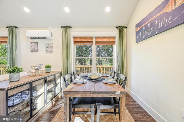 dining area with a healthy amount of sunlight and an AC wall unit