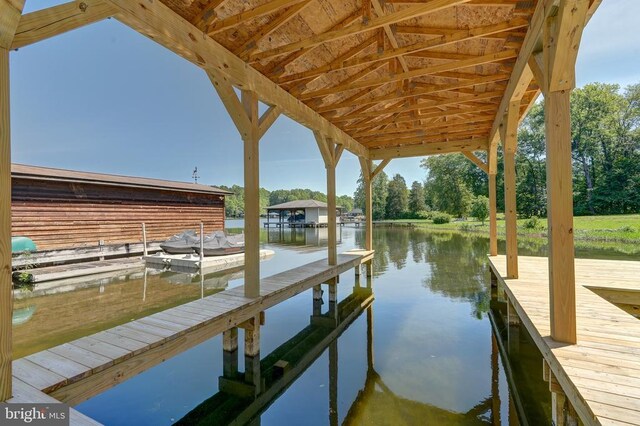 dock area with a water view