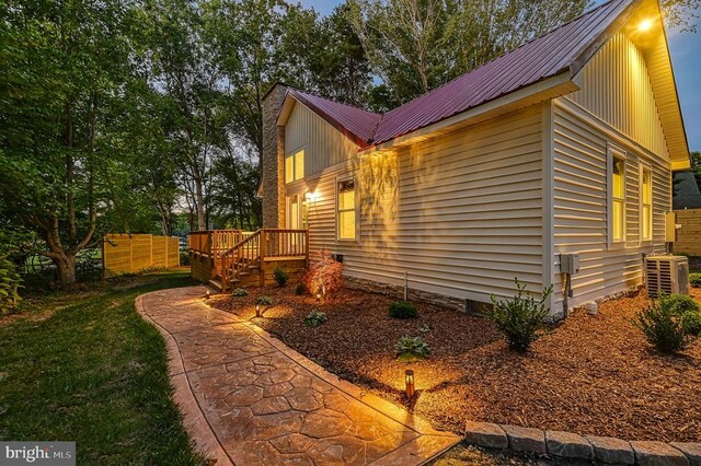 view of side of property featuring cooling unit