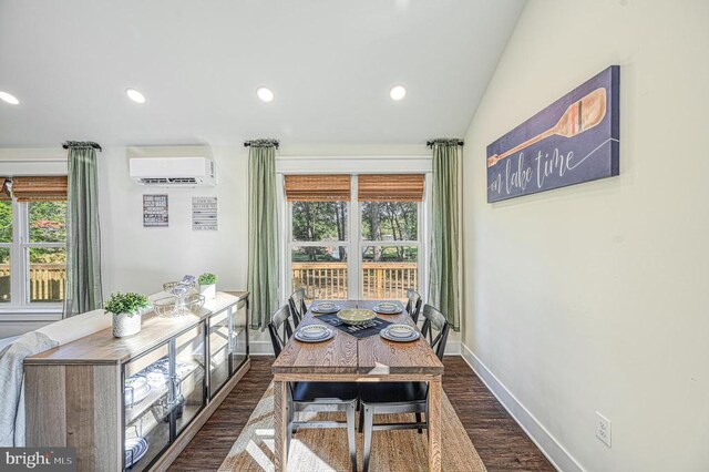 dining space with vaulted ceiling, a healthy amount of sunlight, a wall mounted AC, and dark wood-type flooring