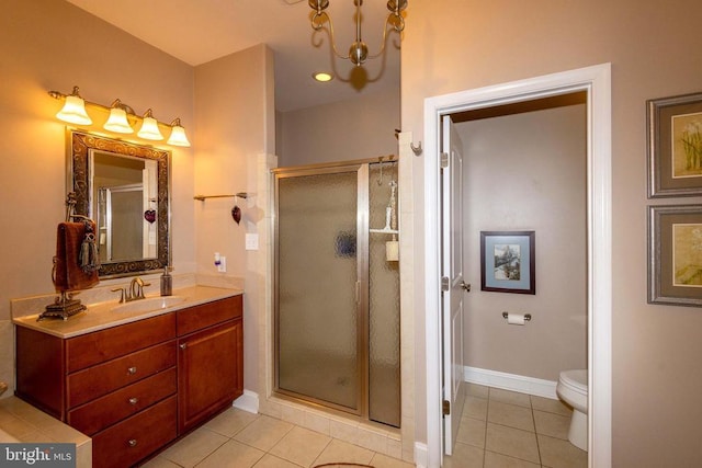 bathroom featuring vanity, baseboards, tile patterned flooring, a shower stall, and a notable chandelier