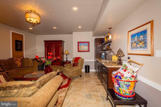 living room with recessed lighting and baseboards