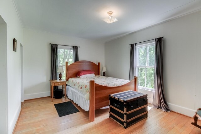 bedroom with light hardwood / wood-style floors