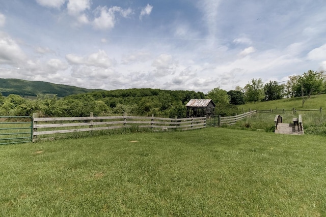 view of yard with a rural view