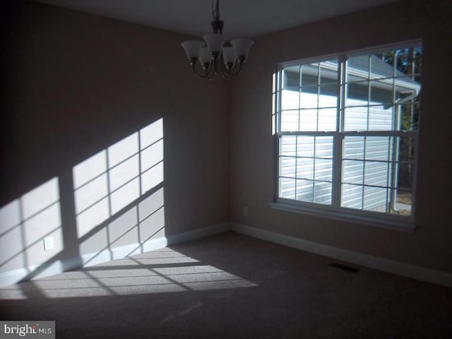 unfurnished dining area with a chandelier