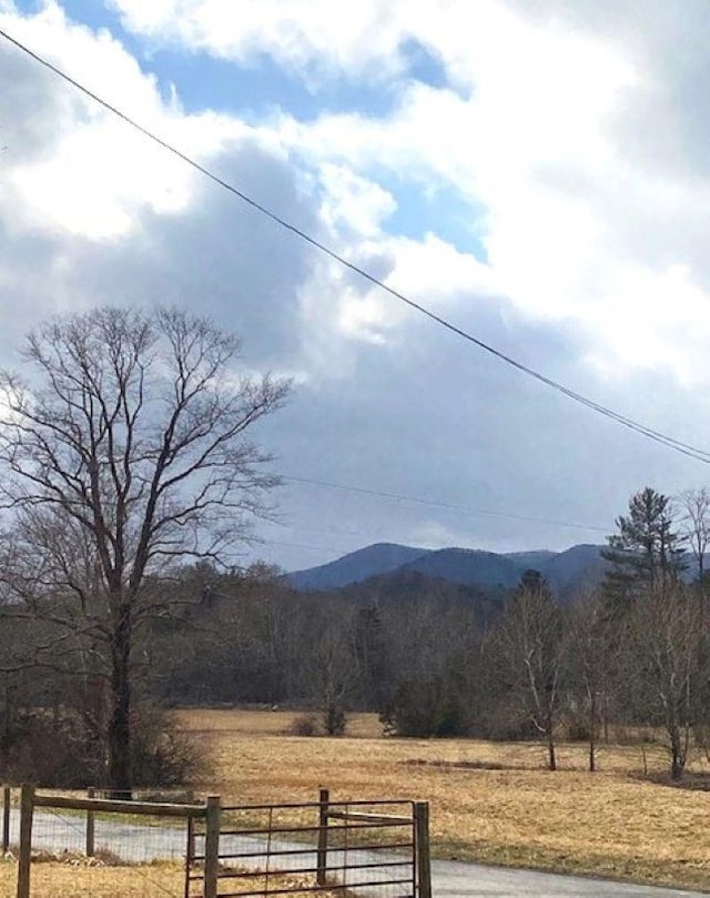 mountain view featuring a rural view