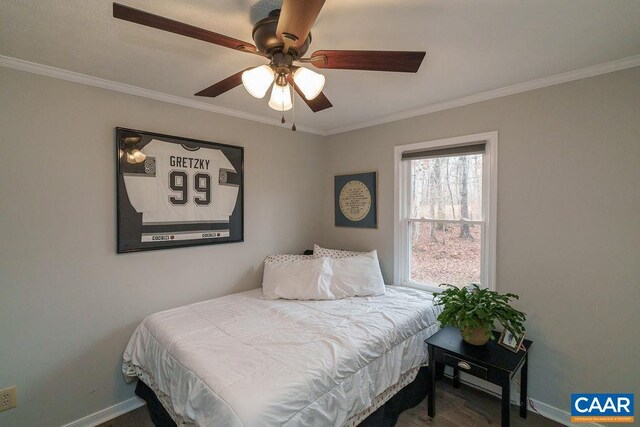 bedroom featuring crown molding, baseboards, and ceiling fan