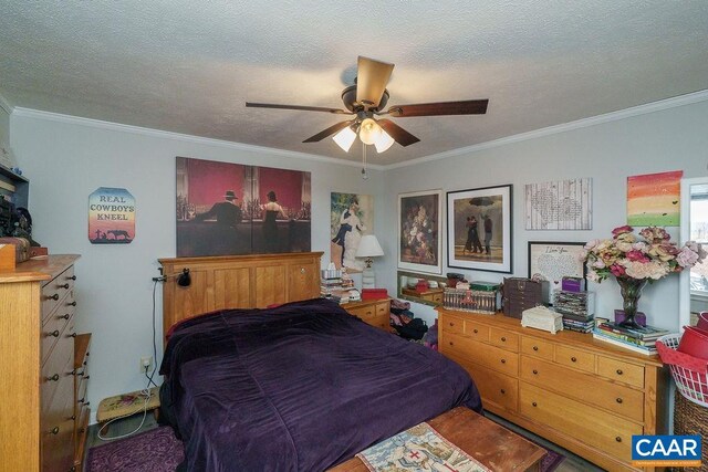 bedroom featuring a ceiling fan, crown molding, and a textured ceiling