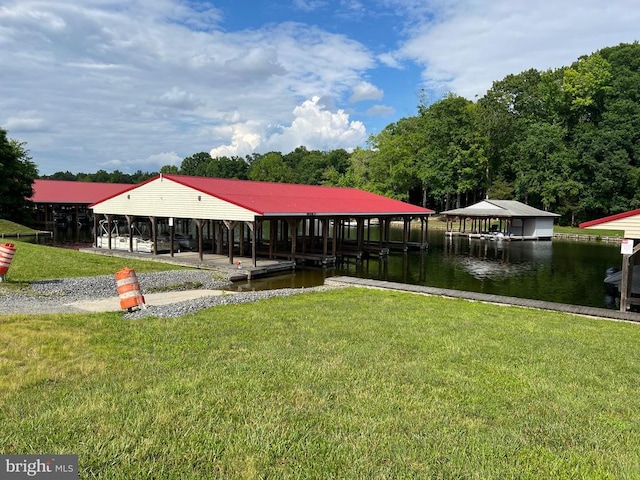 surrounding community with a yard, a dock, and a water view