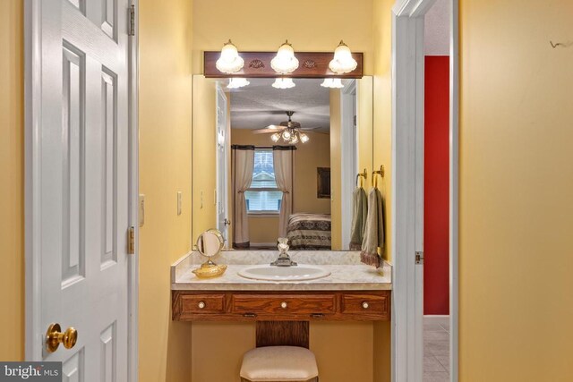 bathroom featuring ceiling fan, vanity, and tile patterned floors