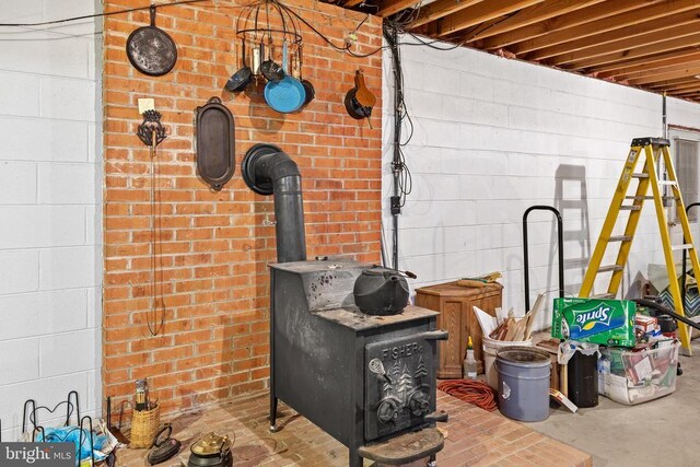 interior details with concrete flooring and a wood stove