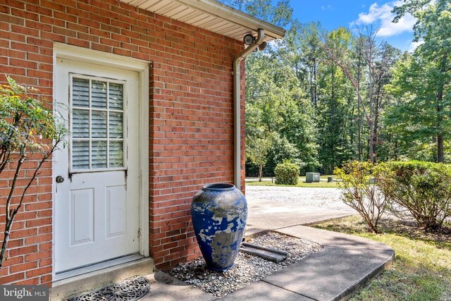 doorway to property with a patio area