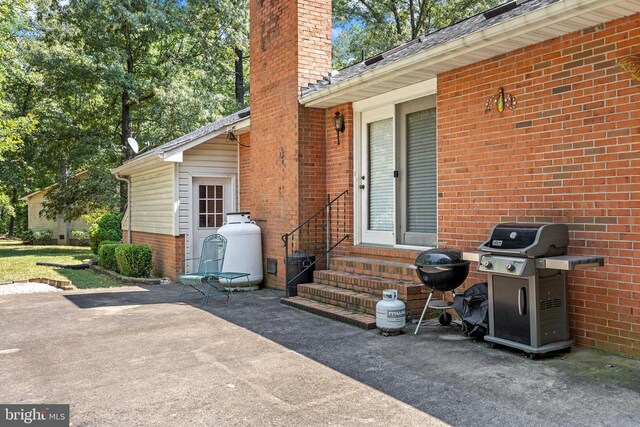 entrance to property with a patio