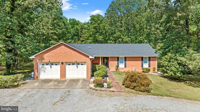 single story home with a garage and a front lawn