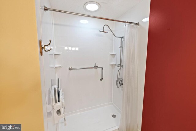 bathroom featuring walk in shower