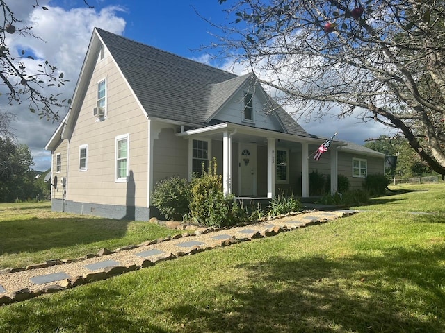 bungalow-style house featuring a porch and a front lawn