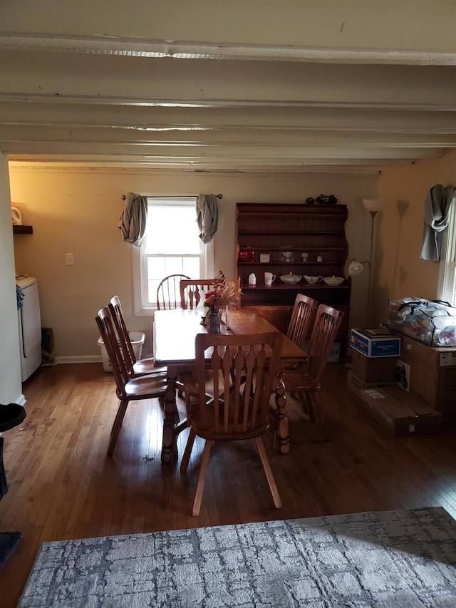 dining space featuring hardwood / wood-style flooring and washing machine and dryer