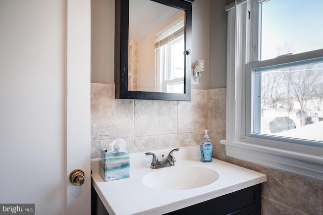 bathroom with tile walls and vanity