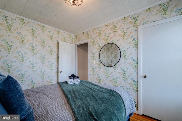 bedroom with wallpapered walls