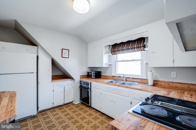 kitchen with white cabinets, black appliances, and a sink