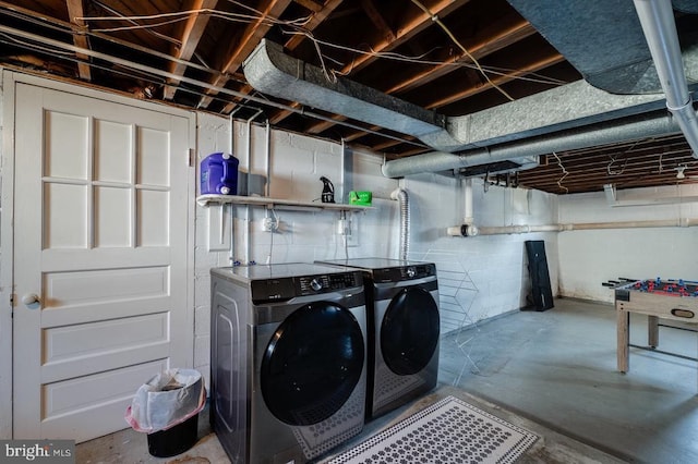 laundry room with washer and dryer and laundry area