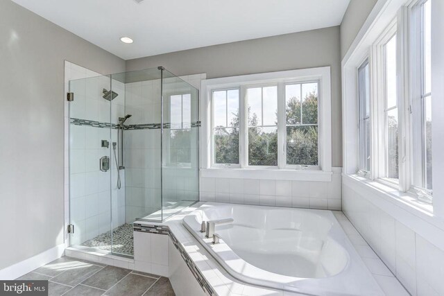 bathroom featuring separate shower and tub and tile patterned floors