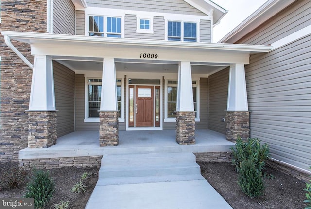 doorway to property featuring a porch