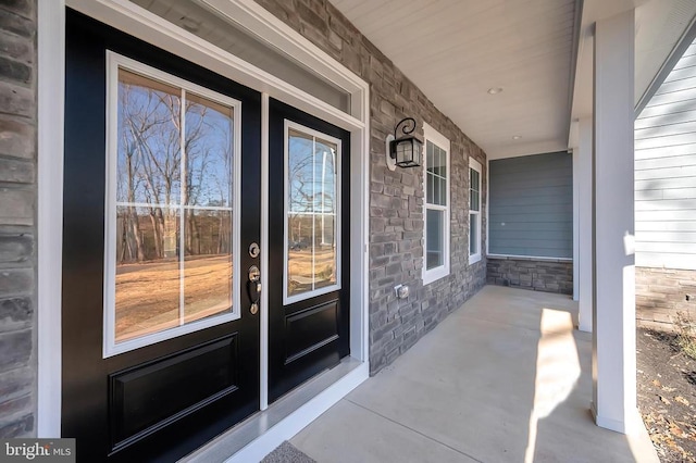 doorway to property with covered porch