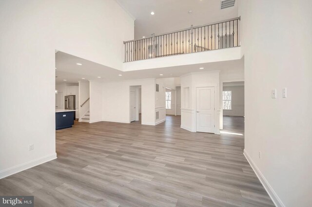 unfurnished living room featuring hardwood / wood-style floors