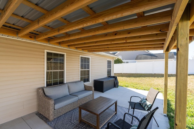 view of patio / terrace featuring grilling area, an outdoor hangout area, and fence