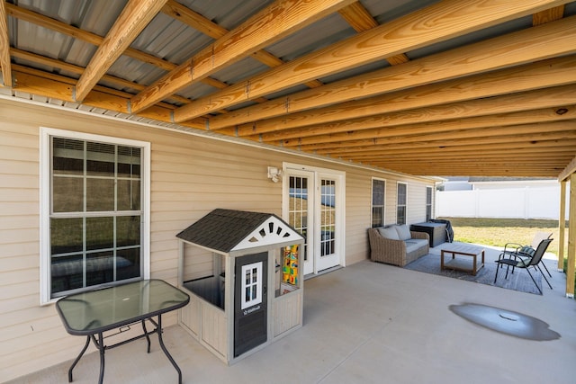 view of patio / terrace featuring fence