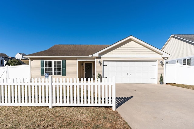 ranch-style home with a fenced front yard, a garage, and driveway