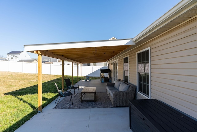 view of patio / terrace featuring outdoor lounge area and fence