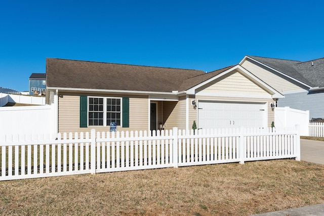 single story home with a fenced front yard, concrete driveway, and an attached garage