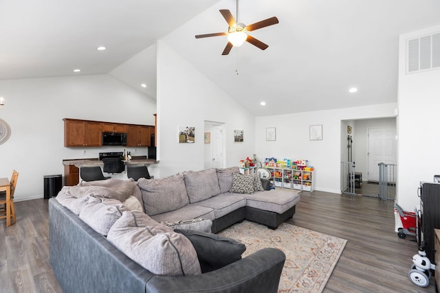 living room featuring visible vents, dark wood-type flooring, recessed lighting, high vaulted ceiling, and a ceiling fan